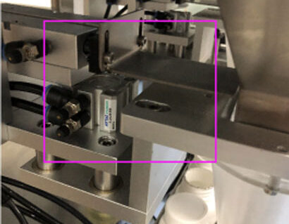 a vibratory pellet-dropping mechanism